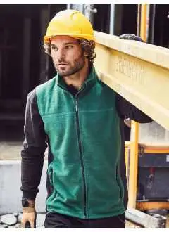 100% poliestere. Tessuto esterno (280 g/m²). Easy care, anti pilling, in microfleece, inserti elastici laterali in soft shell di colore contrastante, cerniera nascosta e protezione per il mento, colletto alto, due tasche laterali con cerniera.