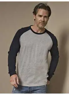 100% coton peigné. Chemise baseball homme, manches raglan, bande de renfort sur les épaules, manches avec poignets.  Couleurs Heather: 5% cot. 15% vis.